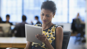 Woman writing down leadership development "hacks" from the experiences CCL has had developing leaders in the tech industry and Silicon Valley