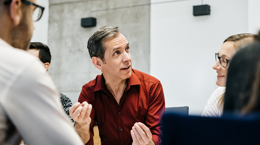 Individuals at polarity management training, learning how to handle leadership paradox and leadership polarities