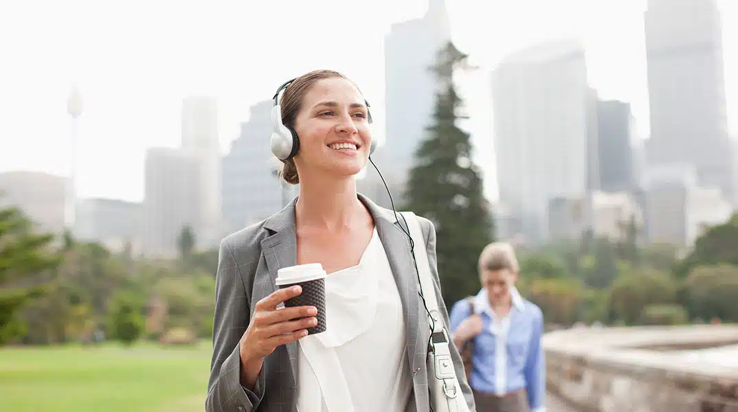 woman walking through the park, avoiding stress and burnout by avoiding rumination
